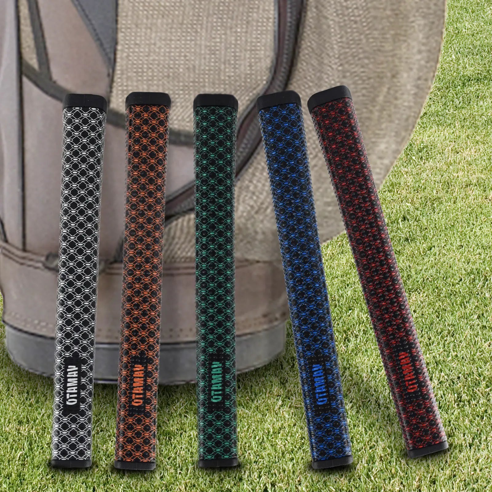 Five Yamato putter grips in different colors—white, black, red, blue, and green—displayed on grass