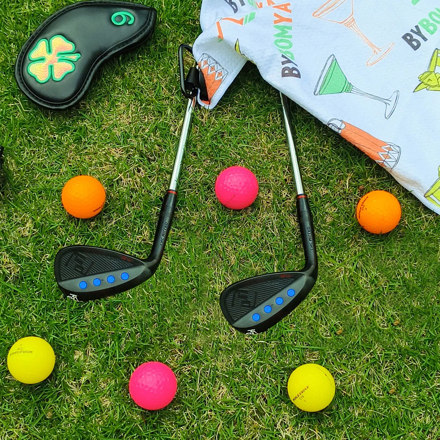 Yamato left-handed wedge set placed on turf in golf course setting