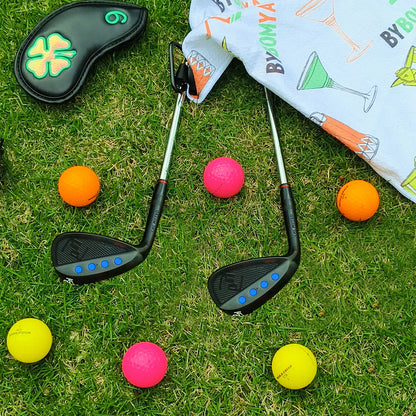 Yamato left-handed wedge set placed on turf in golf course setting